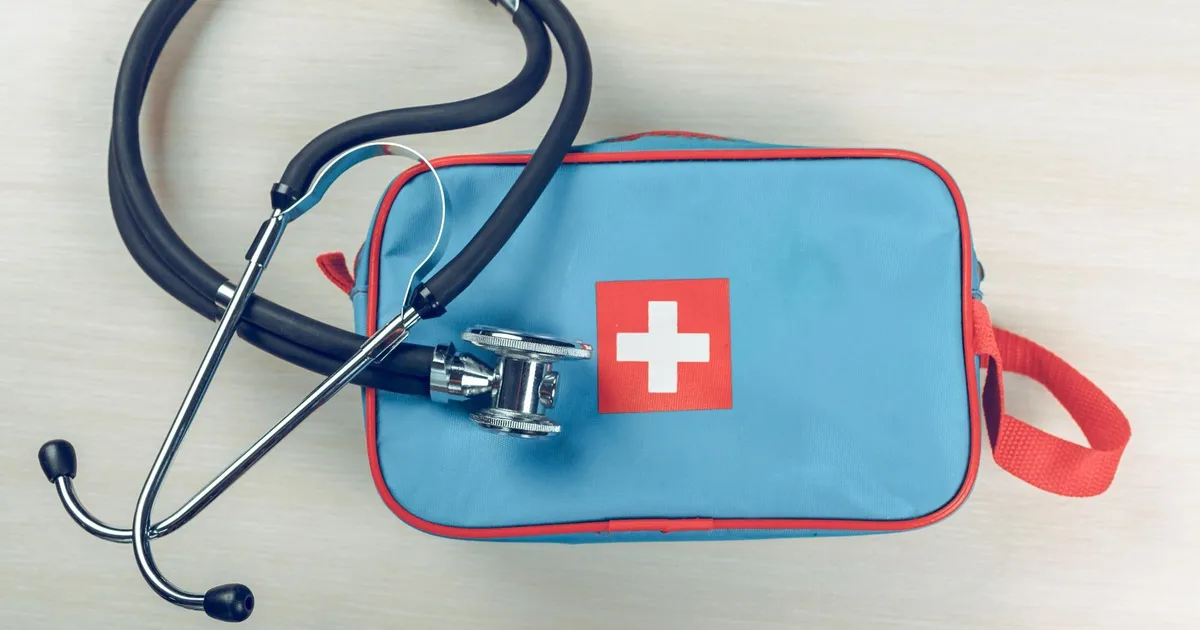 Open first aid kit with organised medical supplies and medications for emergency preparedness