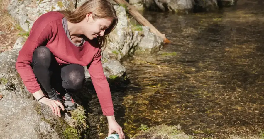 Portable water filter and purification tablets side by side for an emergency comparison