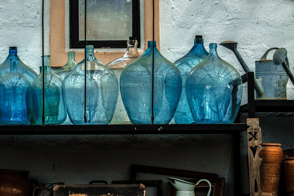 Organised pantry with water bottles and containers stored