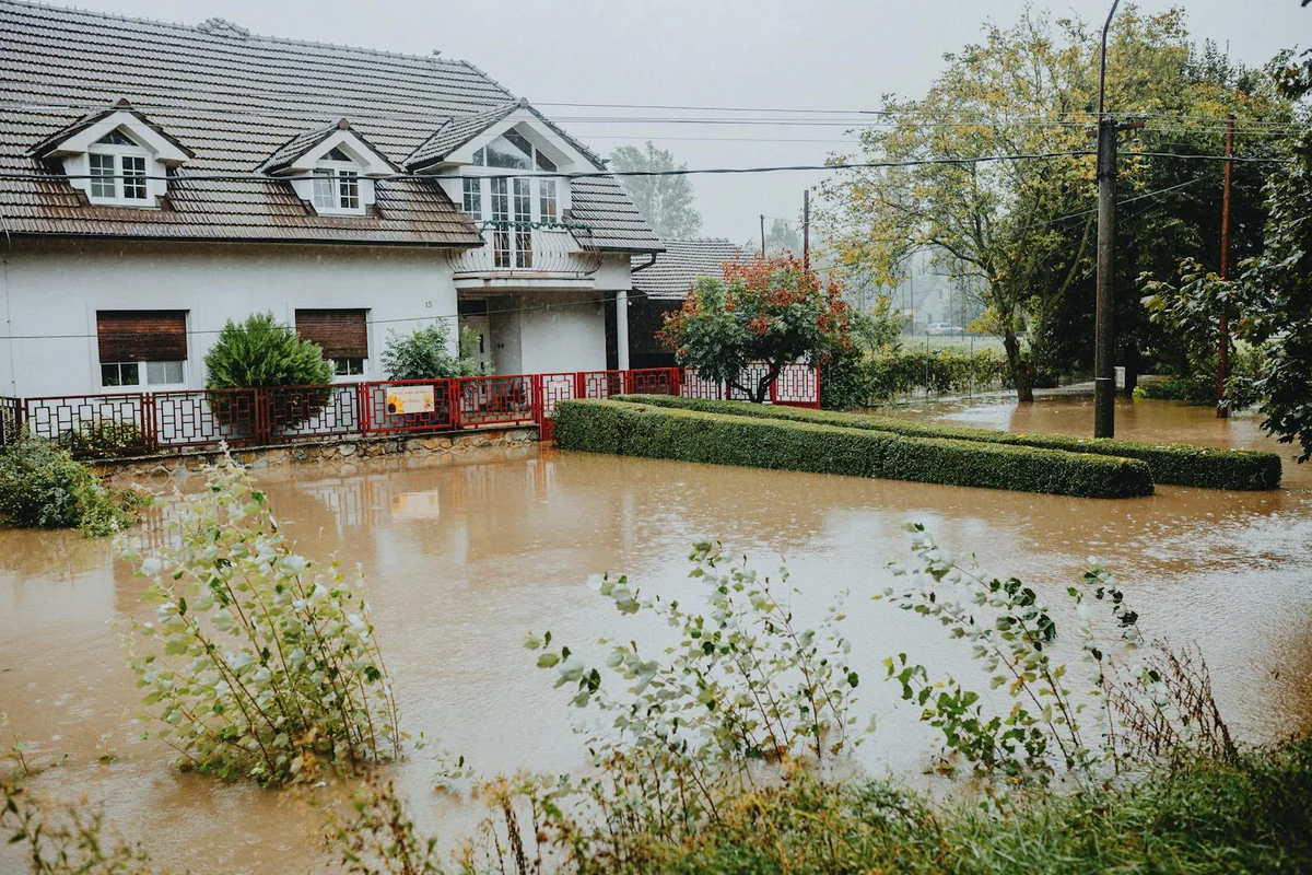 House surrounded by water during a flood